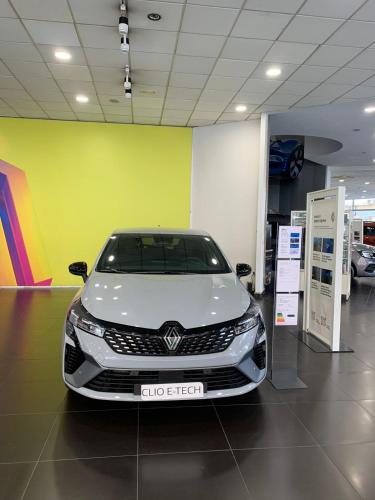 a white car is parked in a garage at Appart hotel tanger in Dakhla