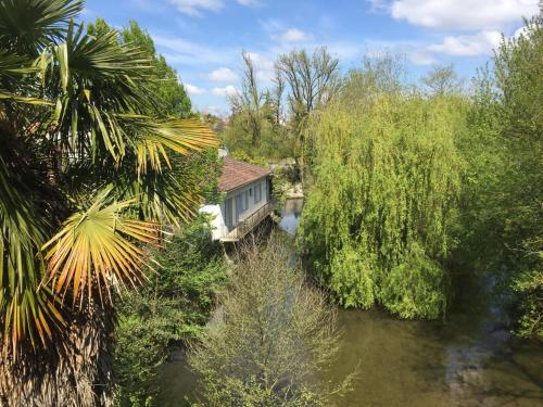 an aerial view of a house next to a river at Moulin Chaillou in Pons