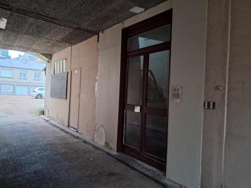 an empty hallway with a door in a building at Autun cœur de ville in Autun