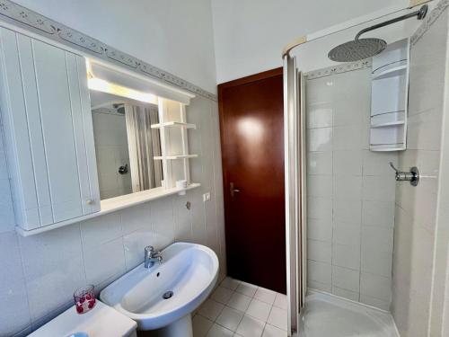 a bathroom with a sink and a shower at RESIDENZA RIO ELBA - Elba Affitti in Rio nellʼElba