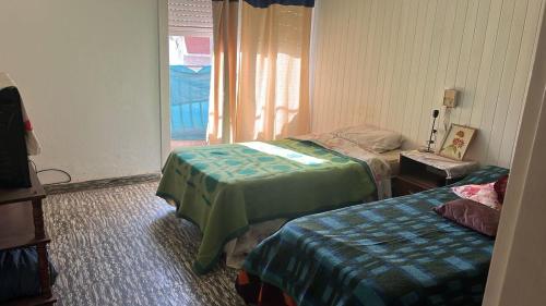 Gulta vai gultas numurā naktsmītnē Departamento 3 dormitorios en Santiago del Estero Capital