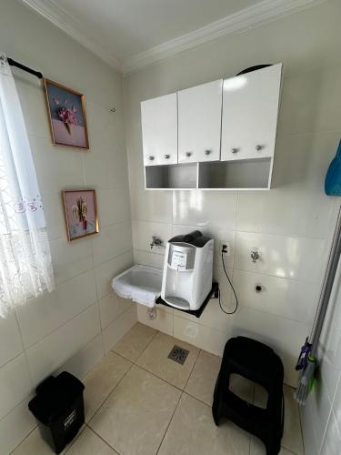 a kitchen with a toaster sitting on a counter at Apartamento WJM in Espirito Santo Do Pinhal