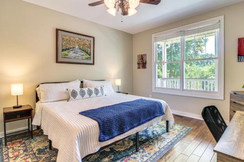 a bedroom with a bed and a window at Modern Tims Ford Lake Home with Private Dock and Pool! in Lynchburg