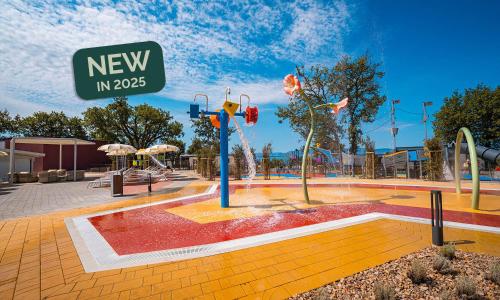 a park with a water park with a playground at Aminess Style Glamping Villas & Holiday Homes Atea in Njivice
