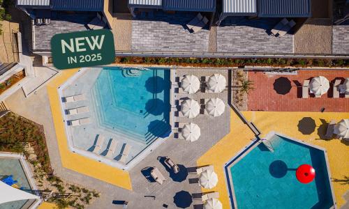 an overhead view of a swimming pool at a resort at Aminess Style Glamping Villas & Holiday Homes Atea in Njivice