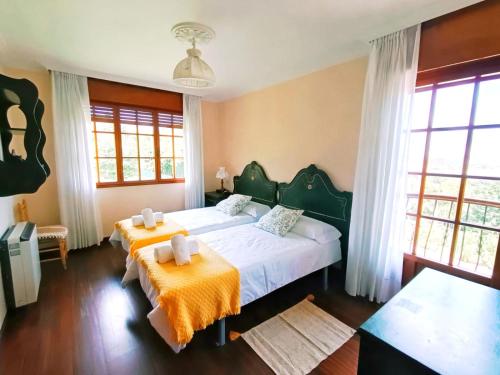 Postel nebo postele na pokoji v ubytování Casona La Zampuca
