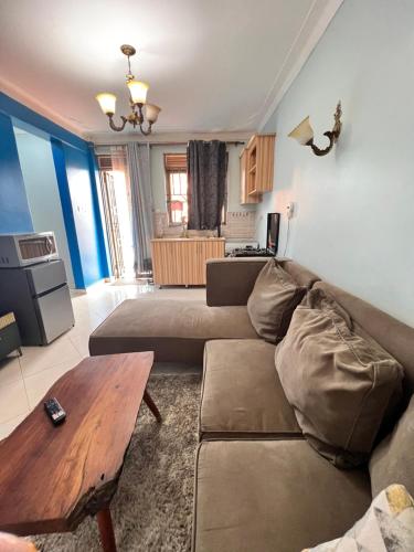 a living room with a couch and a table at City haven in Kampala
