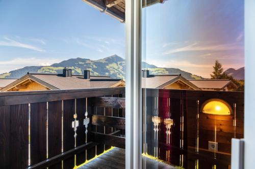 a balcony with a view of the mountains at Pension Heidelberg in Hopfgarten im Brixental