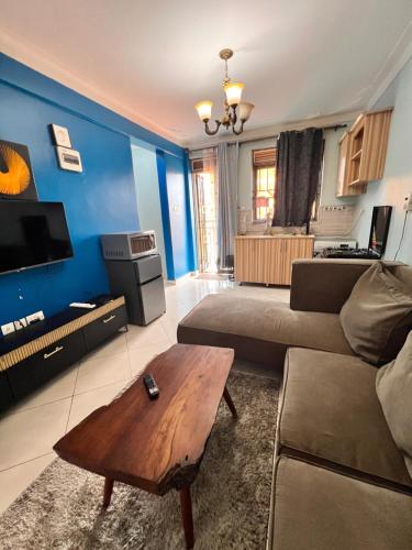 a living room with a couch and a coffee table at City haven in Kampala