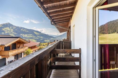 a balcony with a view of the mountains at Pension Heidelberg in Hopfgarten im Brixental