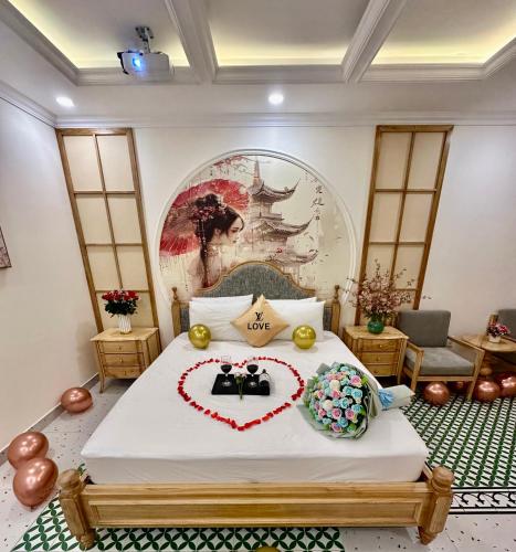 a bedroom with a bed with a heart made up at Love Luxury Hotel Vườn Lài in Ho Chi Minh City