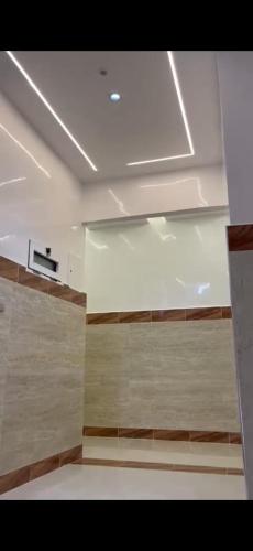 a room with a white ceiling and a wall at Résidence Martil Deluxe in Martil