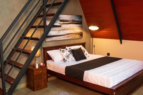 Ένα ή περισσότερα κρεβάτια σε δωμάτιο στο Swarna Nature Villa