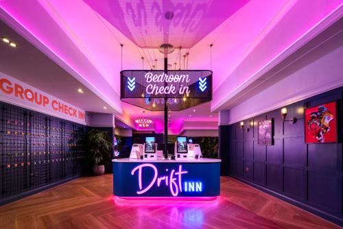 a restaurant with a sign that reads drift inn at Drift Inn formerly the Waterfront Hotel in Saint Neots