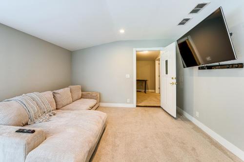 a living room with a couch and a flat screen tv at 7,100 Sq Ft Retreat with Gazebo and Koi Pond in Wayne! 