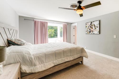 a bedroom with a bed and a ceiling fan at 7,100 Sq Ft Retreat with Gazebo and Koi Pond in Wayne! 