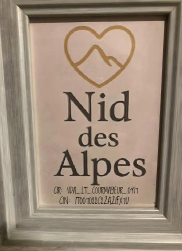 a framed sign with a heart on a wall at Nid Des Alpes - Courmayeur in Courmayeur