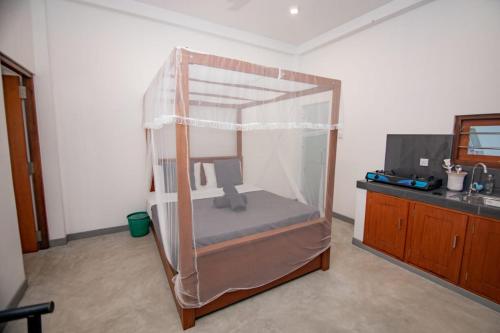 a glass room with a computer inside of it at Harmony Haven Hiriketiya in Dickwella