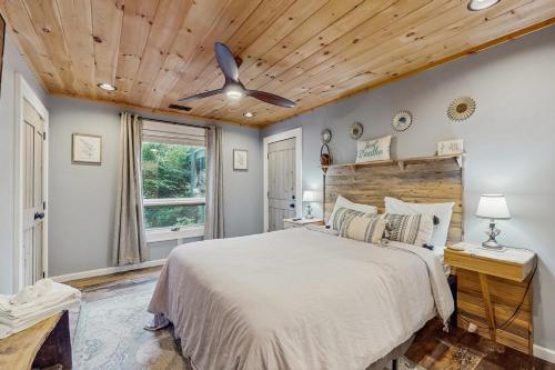 a bedroom with a bed and a ceiling fan at Bee Branch 05 in Sugar Mountain