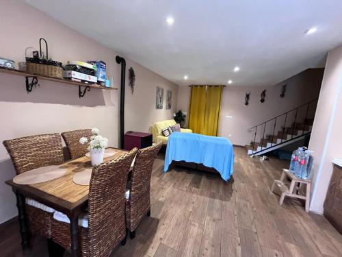 a living room with a table and chairs at Casa de campo in Illana