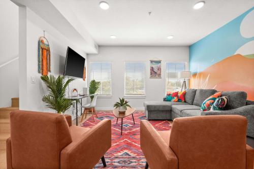 a living room with a couch and chairs at Natl Park 2BR Townhome King 2-Car Garage in Salt Lake City