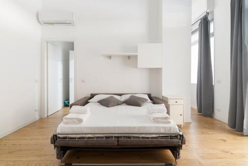 Ένα ή περισσότερα κρεβάτια σε δωμάτιο στο GuestHost - Apartment near Parco Adriano Milano