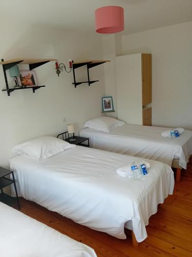 a group of three beds in a room at circuit expo zenith in Le Mans