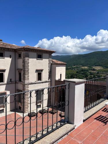 a building with a fence in front of it at Acquasparta Piazza in Acquasparta