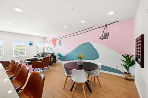 a living room with a table and chairs at Cozy Ski Lodge 2BR 2BA Rooftop Garage in Salt Lake City