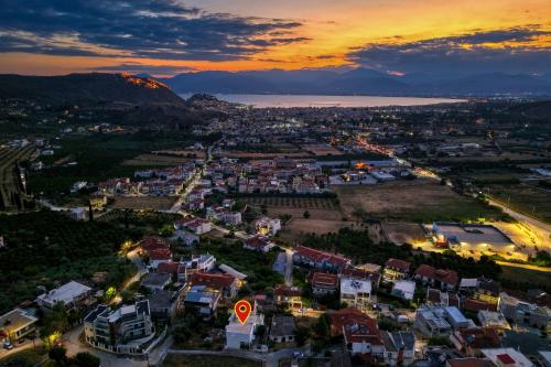an aerial view of a city at sunset at Faytale Apartment Nafplio in Ária