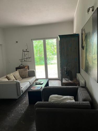 a living room with a couch and a table at Park Residence Bei Wu in Wesenberg