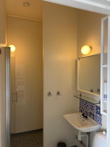 a bathroom with a sink and a toilet at Marinan Richters in Fjällbacka