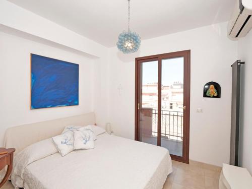 Ένα ή περισσότερα κρεβάτια σε δωμάτιο στο Blue Horizon - Vista mare con AC