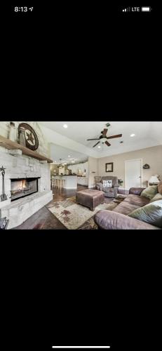 a living room with a couch and a fireplace at Little House on the Corner in Livingston