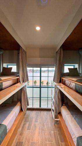 Ein Bett oder Betten in einem Zimmer der Unterkunft Adra Hostal Peten