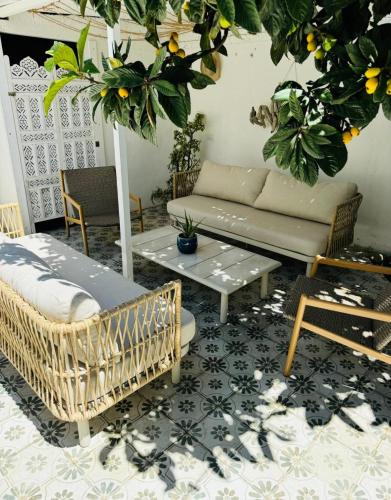 a living room with a couch and a table at Casa Sasa in Porto Cesareo