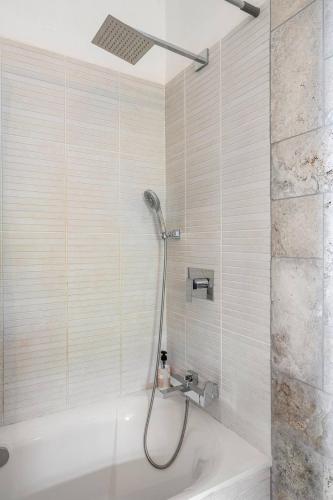 a bathroom with a shower with a bath tub at Quiet and Spacious Luxury Apartment with Splendid View between Carmel and Downtown in Haifa