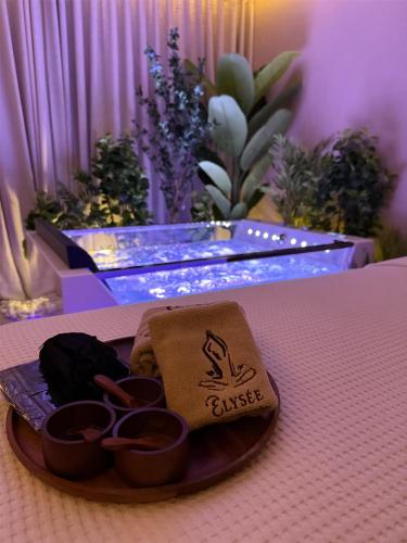 a tray with some cups on a table at Park Inn by Radisson Hotel & Apartments Kuwait in Kuwait