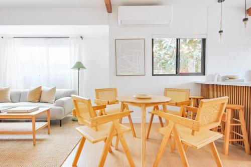 a living room with a table and chairs at 2 Units Oasia Villa w terrace 12 pax in Los Angeles