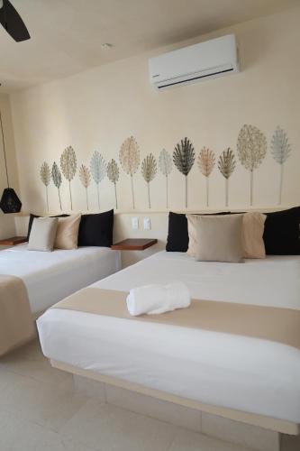 Ein Bett oder Betten in einem Zimmer der Unterkunft sunsteps casa Holbox