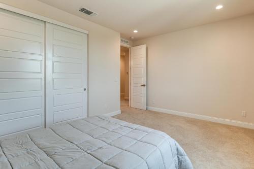 a bedroom with white cabinets and a bed at Patio and Outdoor Kitchen Manteca Family Home in Manteca