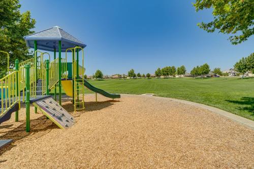 a playground with a slide in a park at Patio and Outdoor Kitchen Manteca Family Home in Manteca