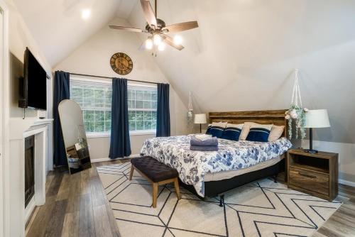 a bedroom with a bed and a ceiling fan at Adventures on Alleghany in McGaheysville