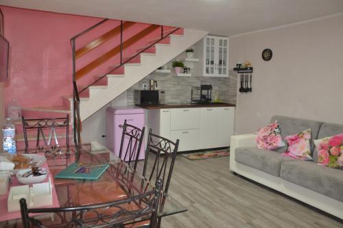 a living room with a couch and a glass table at CASA VACANZE - LA CASINA DI LALLA - Greccio in Greccio