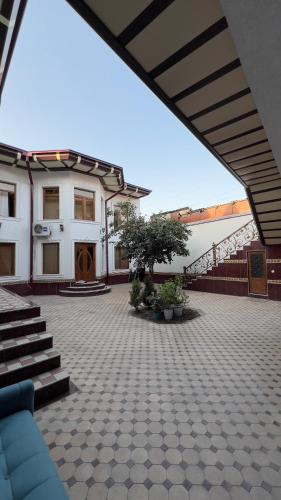 a patio with stairs and a building with a stair case at B&B Giza in Samarkand