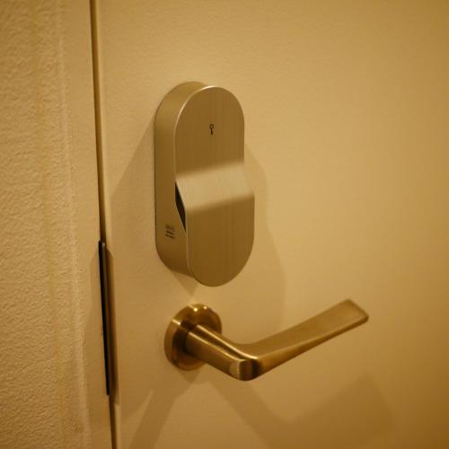 a door with a door knob on a door with a door at まえばしガレリアArt residence & Hotel in Maebashi
