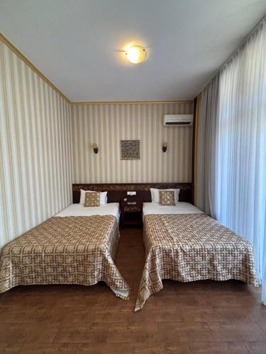 Katil atau katil-katil dalam bilik di Odeska Astoria Arcadia Hotel