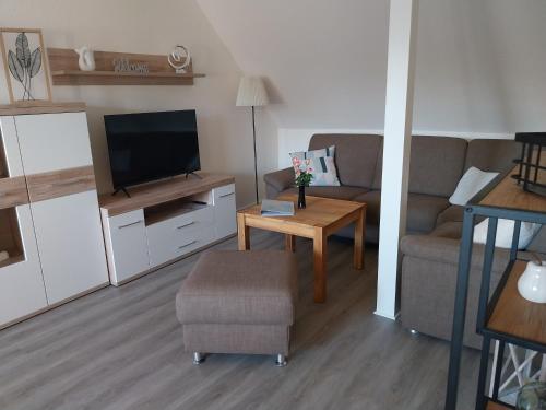 TV a/nebo společenská místnost v ubytování Ferienwohnung Mumm