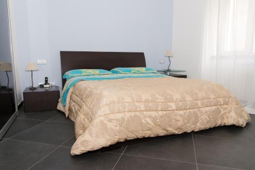a bedroom with a large bed and two night stands at Casa Grace in Massa Lubrense