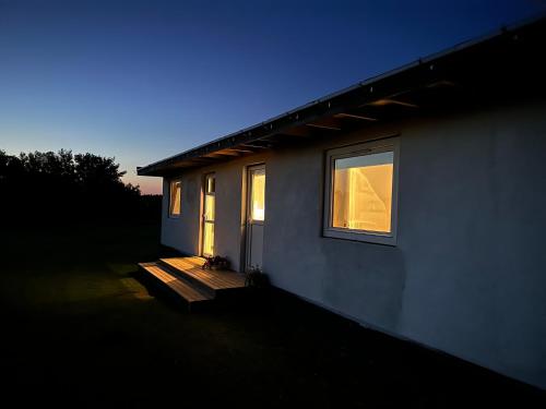 a house with a window on the side of it at Fishermans House Apartment 2 in Hirtshals